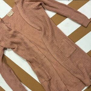 Faded pink sweater shall